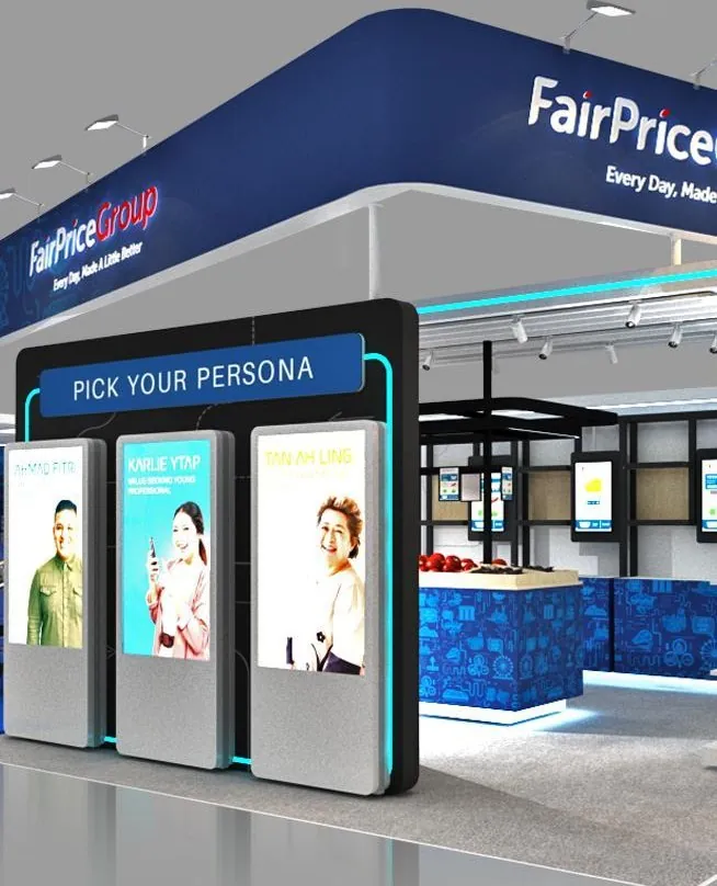 Store of Tomorrow for FairPrice Group — "Pick Your Persona" — three portrait screens set at eye height at the approach corner.